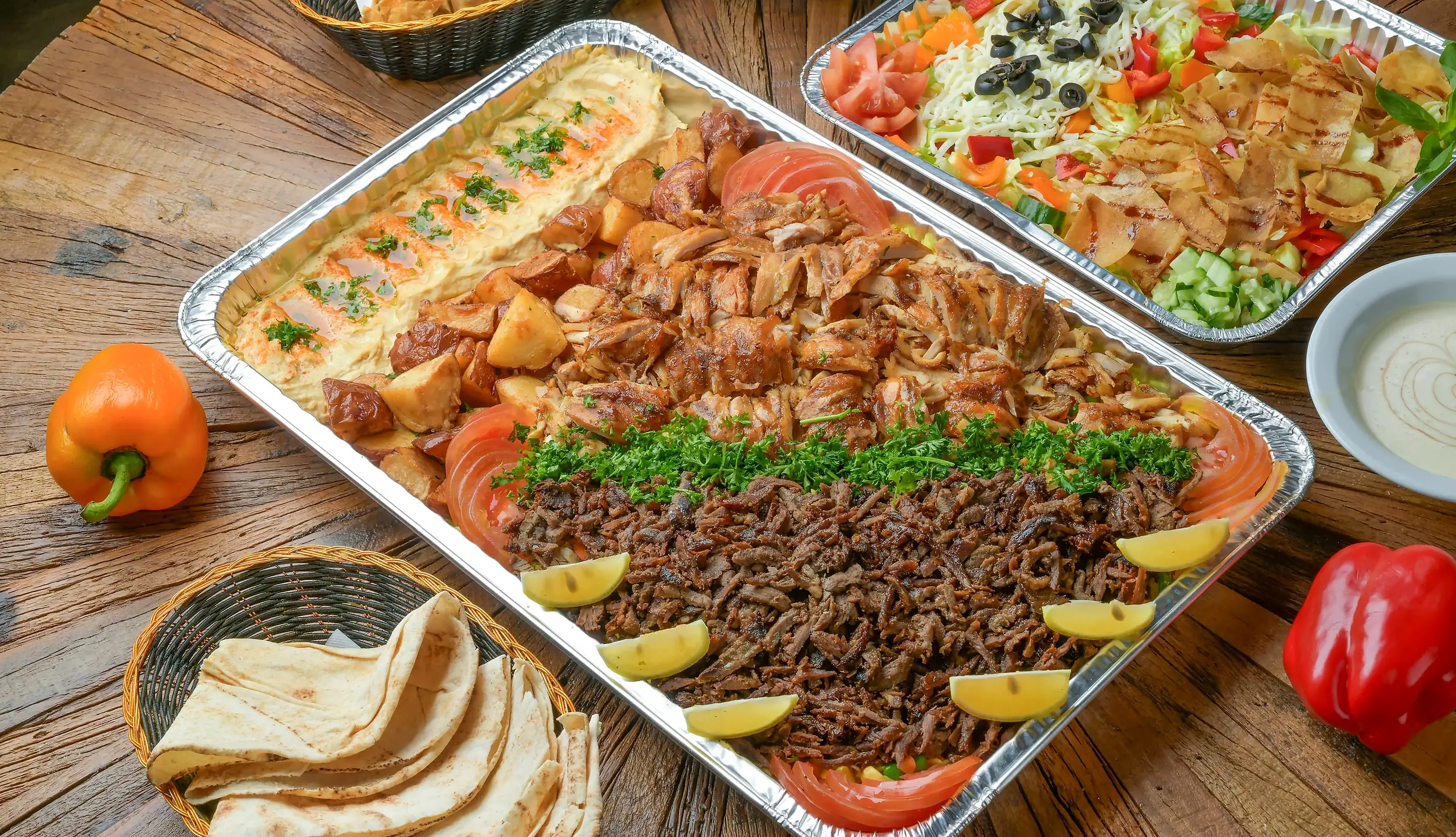 Shawarma platter tray with hummus, salad tray and pita