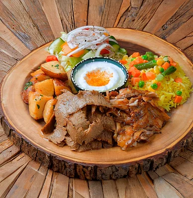 Beef donair plate with rice, garlic potatoes, salad and garlic sauce